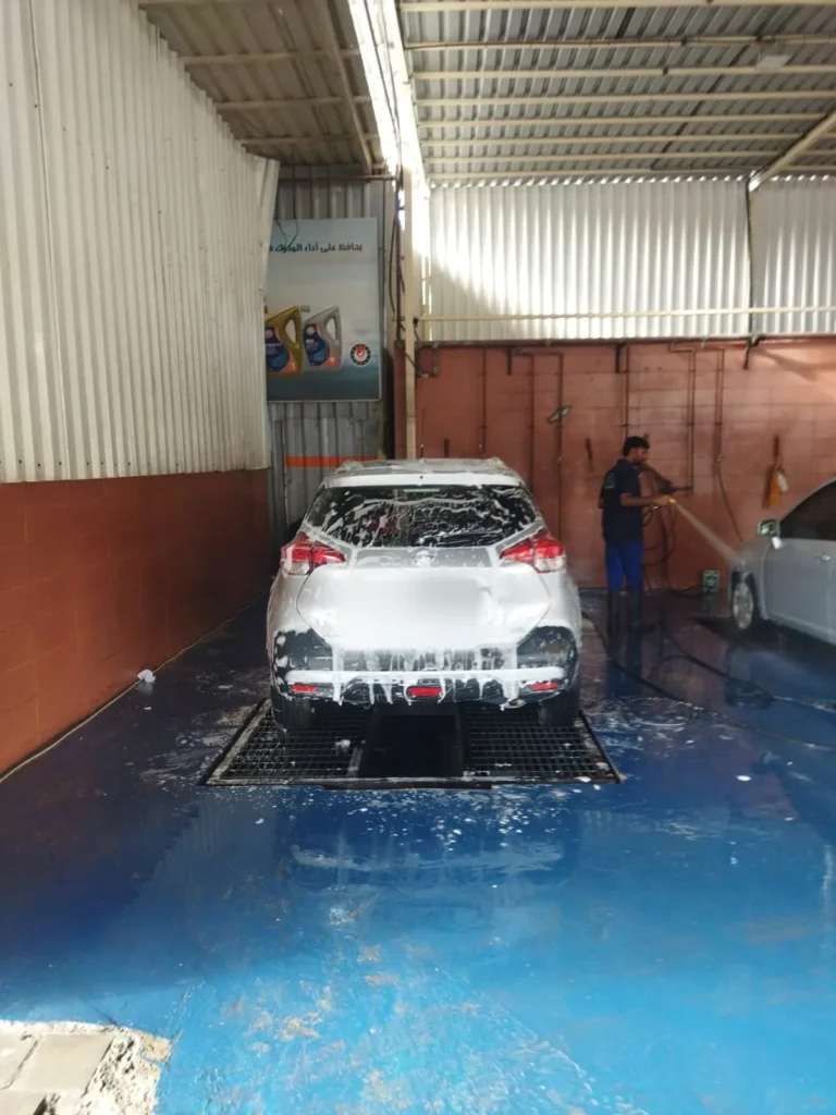 Washing a car in the wash bay